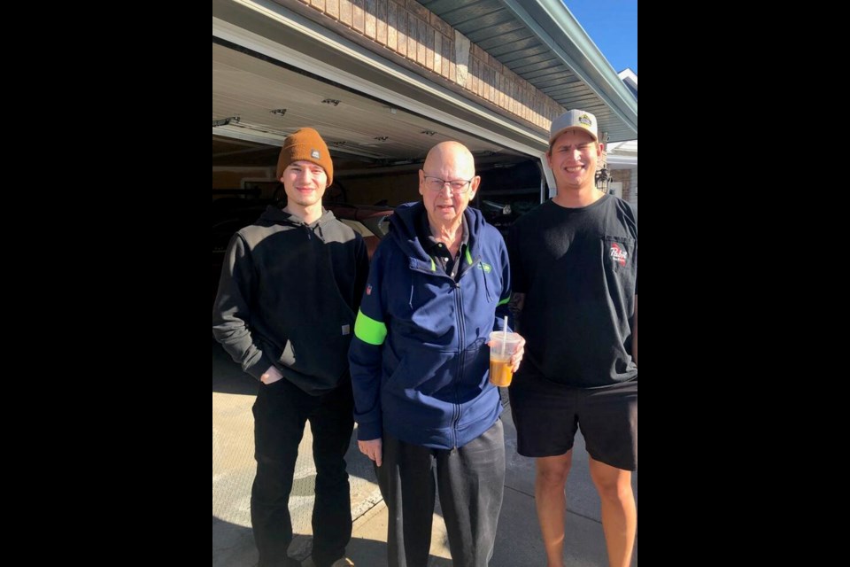Charges have been laid in the death of 80-year-old Pat Hare, pictured with his grandsons Ethan Hare, left, and Ryan Hare. Pat Hare was struck and killed near Qualicum Beach in March after he stopped to help a woman who had hit a power pole. FAMILY PHOTO Charges have been laid in the death of 80-year-old Pat Hare, centre, shown with his grandsons Ethan Hare, left, and Ryan Hare. Pat Hare was struck and killed near Qualicum Beach in March after he stopped to help a woman whose minivan had hit a power pole. A 29-year-old Coombs man is facing six charges. VIA FAMILY 