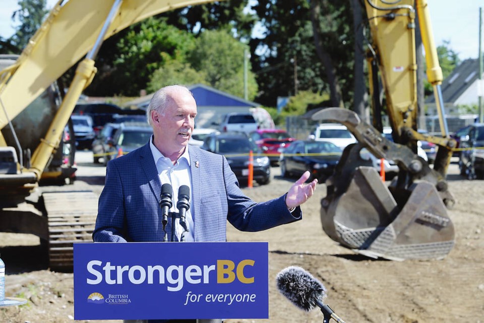 John Horgan speaks in 2022 at the announcement of plans for the Langford post-secondary campus that will now bear his name. ADRIAN LAM, TIMES COLONIST 