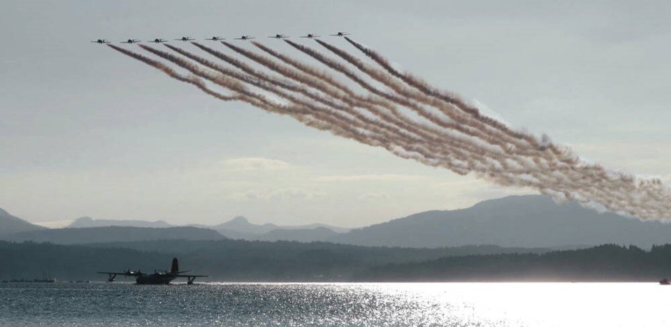 The Snowbirds fly above the Hawaii Martin Mars at Patricia Bay last August. DAVID BLY