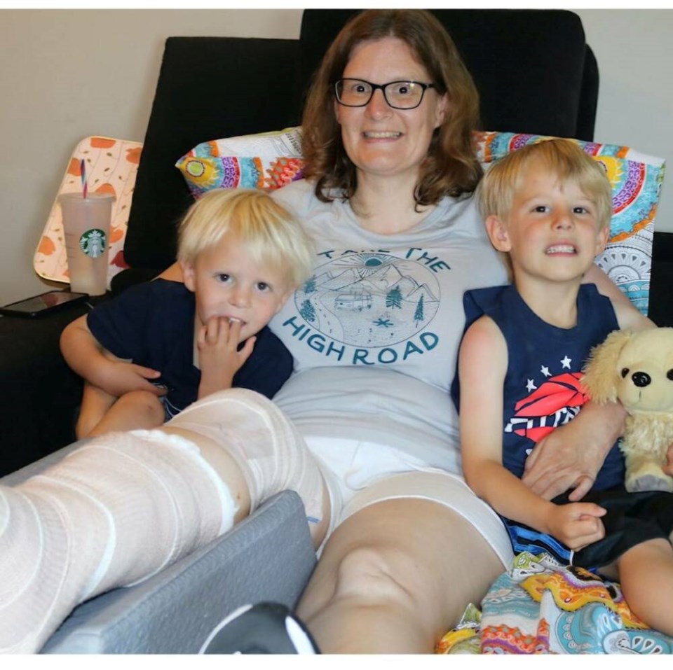 Sarah Lalonde, pictured with her two sons, is upset the City of Colwood did not close a slide in Quarry Park where she broke her leg until after a second person was also injured. VIA SARAH LALONDE