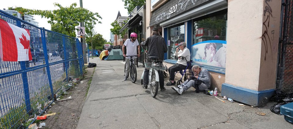 Homeless people along Pandora Avenue between Vancouver and Quadra streets. ADRIAN LAM, TIMES COLONIST