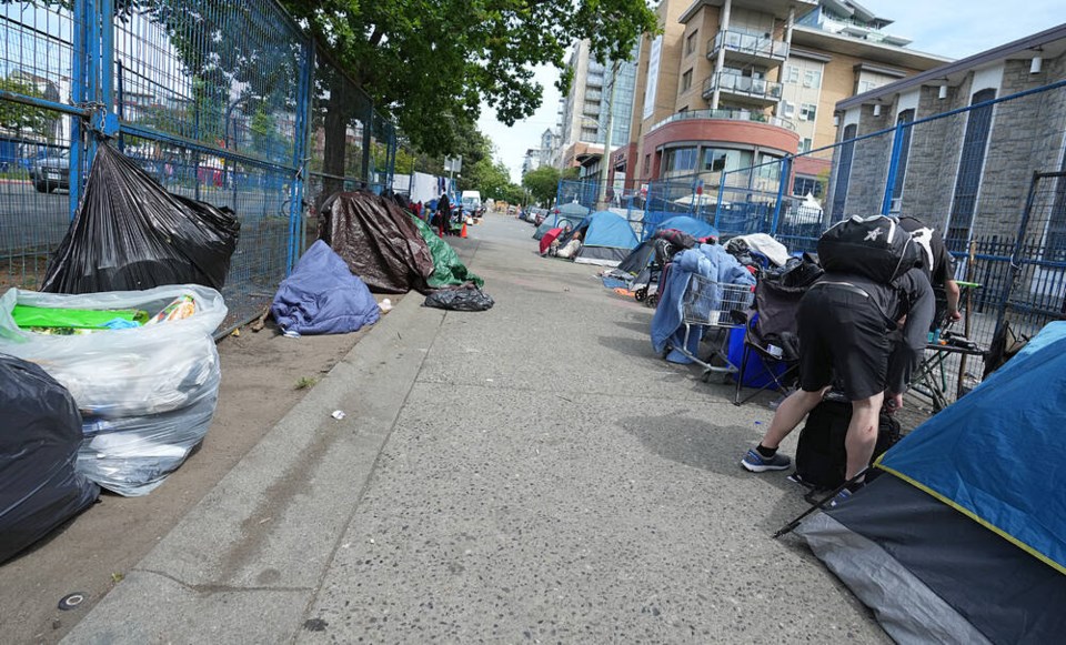 Tents and garbage on Pandora Street between Vancouver and Quadra last month. ADRIAN LAM, TIMES COLONIST