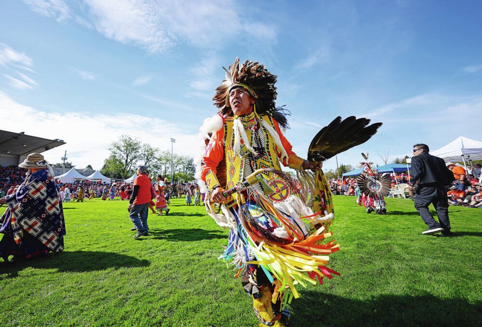 Dean Quirng Little Light takes part in opening ceremonies at the National Day for Truth and Reconciliation annual South Island Powwow at Royal Athletic Park last September. ADRIAN LAM, TIMES COLONIST