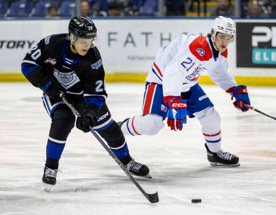 Victoria Royals’ Marcus Loponen moves the puck past Spokane Chiefs’ Owen Martin in a WHL playoff game in April. DARREN STONE, TIMES COLONIST