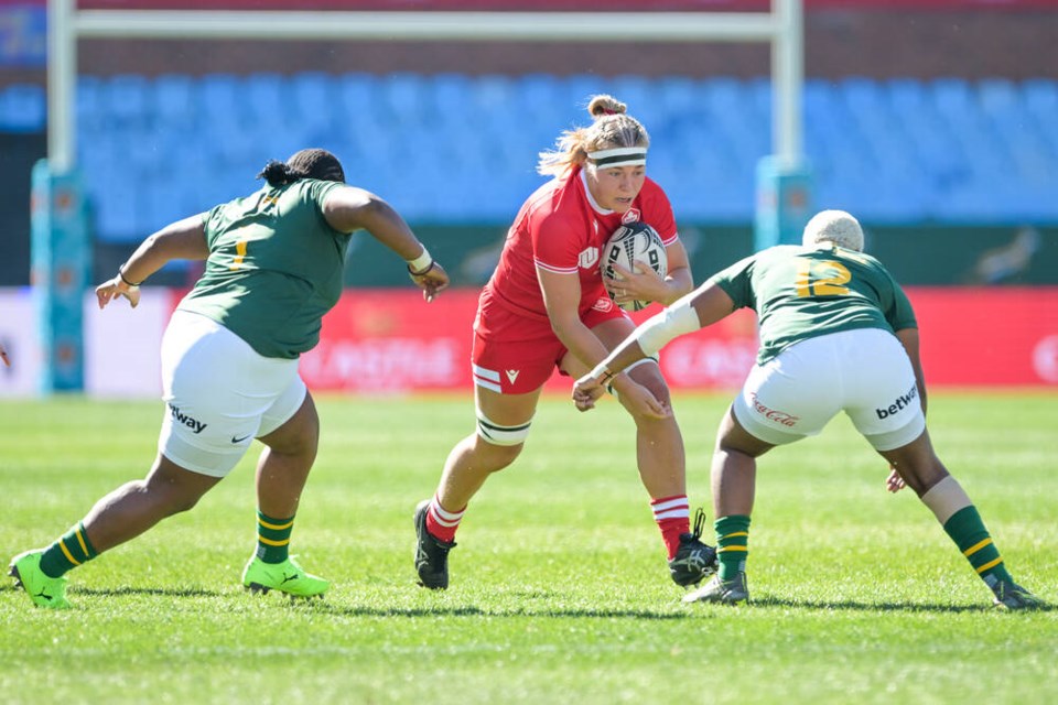 Canadian forward Courtney O’Donnell, centre, carries the ball during Canada’s 50-20 win over South Africa in Pretoria on Saturday. RUGBY CANADA VIA THE CANADIAN PRESS