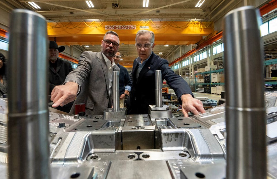 Prime Minister Mark Carney gets a tour of automotive plant ABC Windsor in Windsor, Ont. on March 26. The trade war with the U.S. is ravaging the Canadian economy, particularly the auto sector. FRANK GUNN, THE CANADIAN PRESS