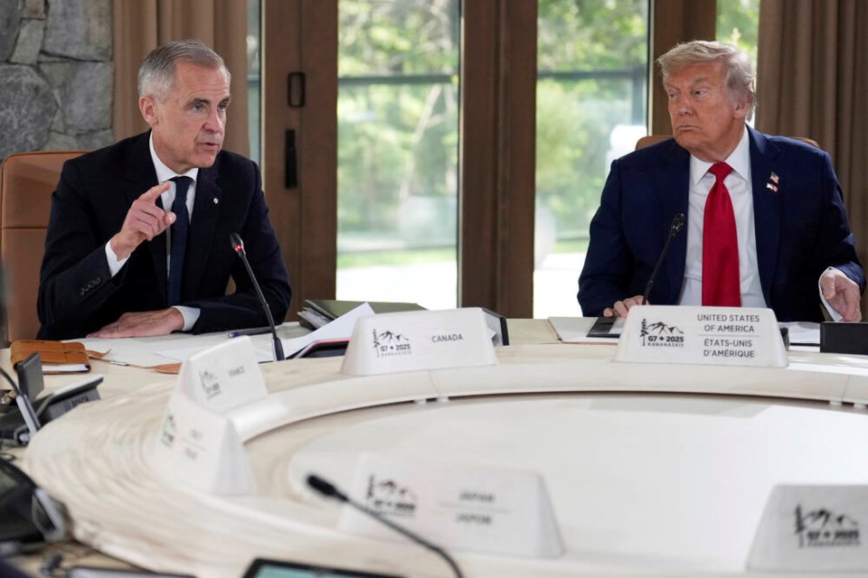 U.S. President Donald Trump, right, and Prime Minister Mark Carney participate in a session of the G7 Summit, Monday, June 16, 2025, in Kananaskis, Alta. (AP Photo/Mark Schiefelbein)