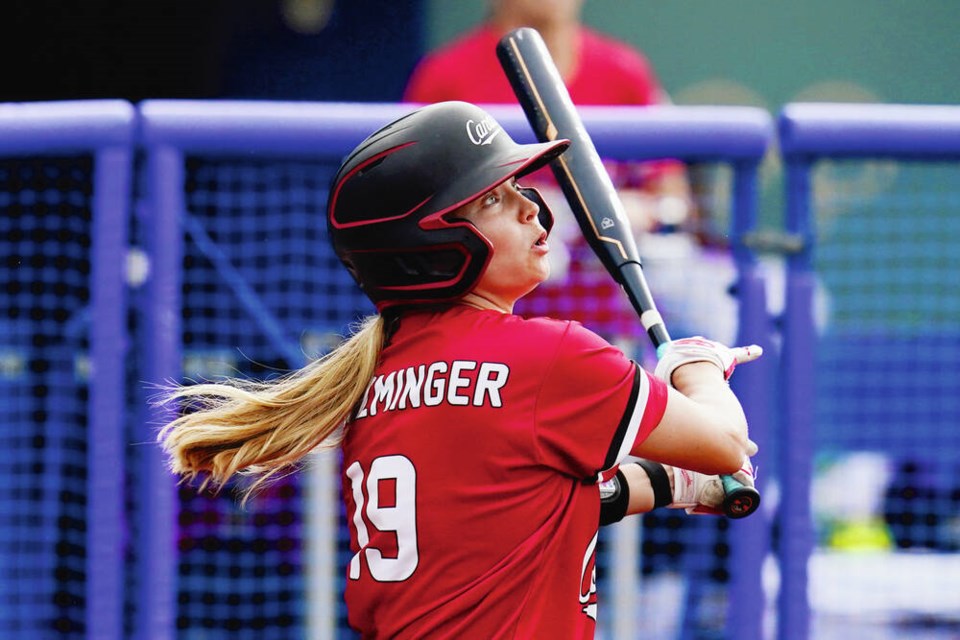 Canada’s Emma Entzminger hits a ball against Mexico during a game at the 2020 Olympic Games in 
Yokohama, Japan, in 2021. Sue Ogrocki, AP