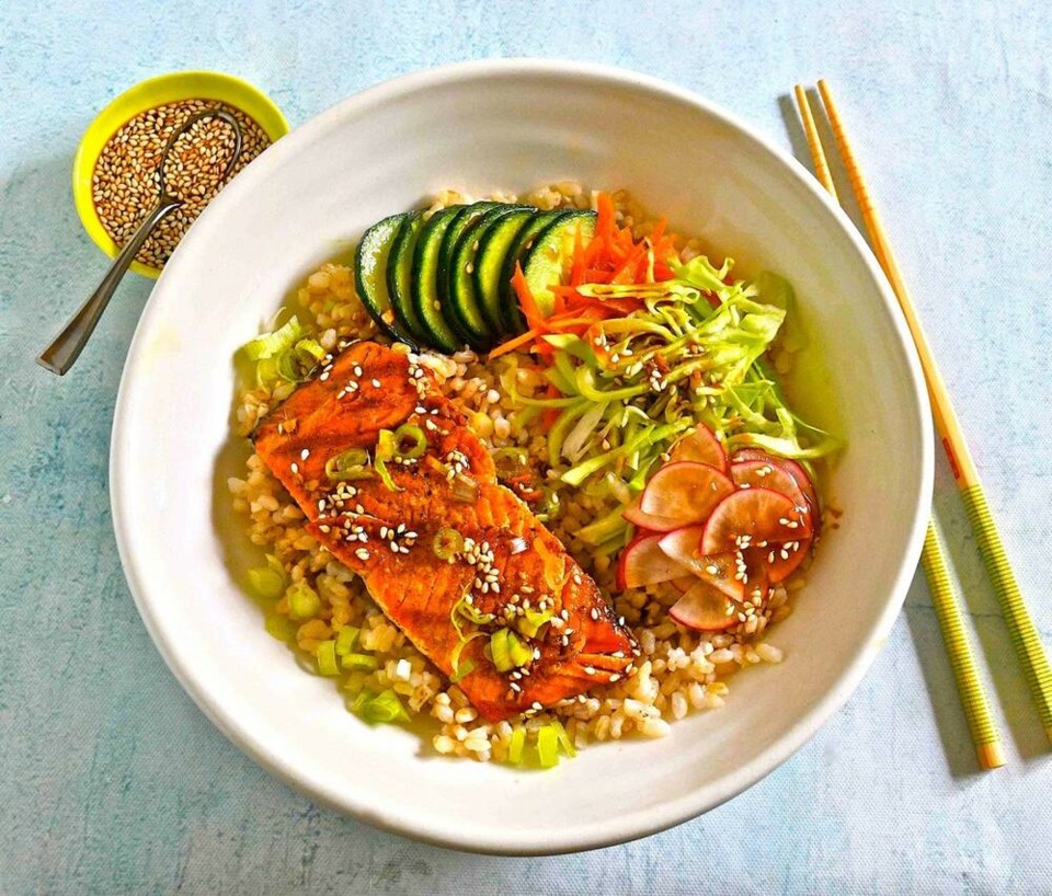 Items one might find into a bento box, a protein, rice and vegetables, tastily presented in a bowl, creating and inviting summer meal. ERIC AKIS