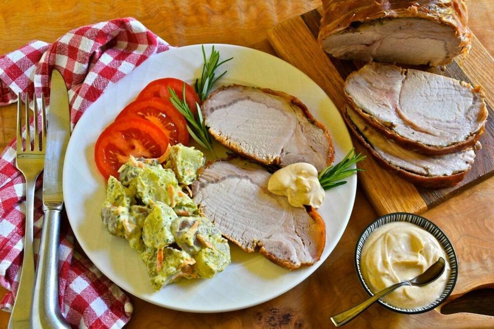 This summer meal pairs chilled prosciutto-wrapped roast pork loin with smoked paprika aioli, pesto potato salad and ripe tomato slices.	ERIC AKIS