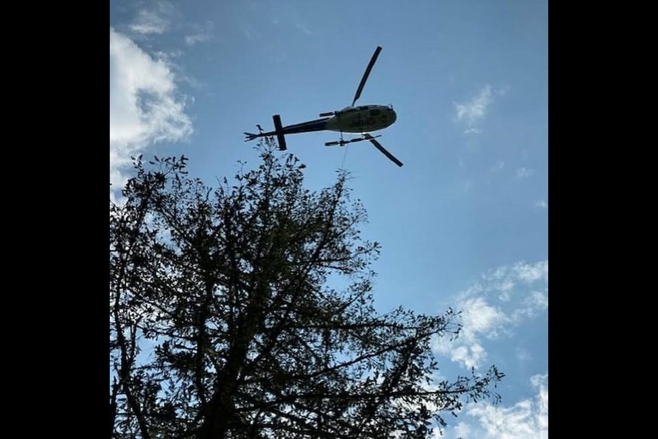 A helicopter helps in the search for a missing woman with dementia near Cumberland. The woman was found with a few scratches but otherwise unhurt. VIA COMOX VALLEY SEARCH AND RESCUE 