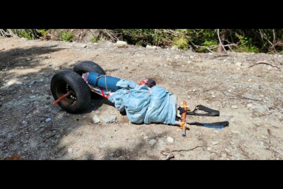 The hiker’s makeshift wagon for his gear, built from spare tires and pieces of metal from his 2000 Chevrolet Cavalier, which was stuck in deep mud and damaged. ALBERNI VALLEY RESCUE SQUAD 