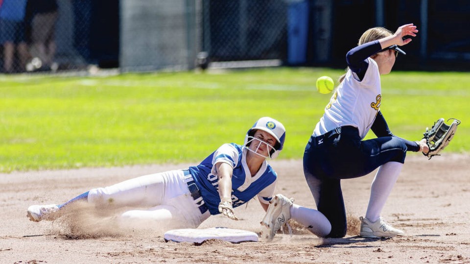Peyton Bryden, right, in action for Langford Lightning against Team Quebec’s Naomi Cohen at the Canadian Under-19 Women’s Fastpitch Championship at Centennial Park in 2023. DARREN STONE, TIMES COLONIST