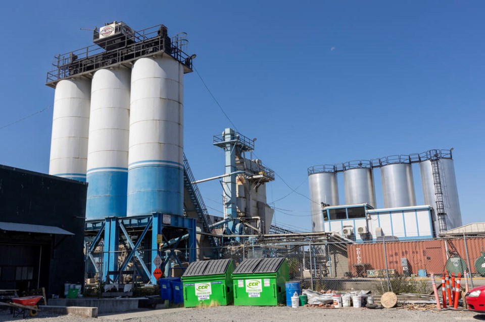 Island Paving has been operating 24 hours a day to manufacture asphalt for Pat Bay Highway paving. Some Saanich and Victoria residents say the pungent smell is causing sleepless nights, nausea, respiratory problems and other health issues. DARREN STONE, TIMES COLONIST