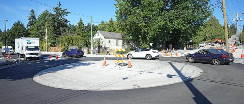 A roundabout at Sinclair and Cadboro Bay roads was paved last week and is expected to be complete by August. ADRIAN LAM, TIMES COLONIST