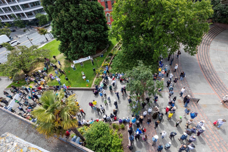 People gather last month to protest Victoria council’s plans for a revamping of Centennial Square. The removal of the much-loved giant sequoia has been indefinitely delayed. DARREN STONE, TIMES COLONIST