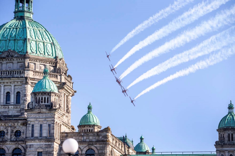 The Snowbirds fly near the legislature on Tuesday evening. DARREN STONE, TIMES COLONIST July 22, 2025 