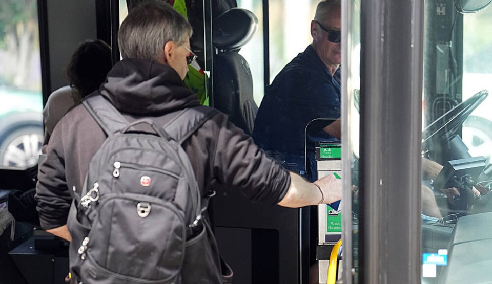 A man scans his UMO card on a B.C. Transit bus this week. ADRIAN LAM, TIMES COLONIST