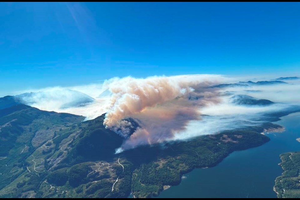 The Mount Underwood wildfire sends out plumes of heavy smoke as it ­continues burning southwest of Port Alberni 
on Tuesday. B.C. WILDFIRE SERVICE 