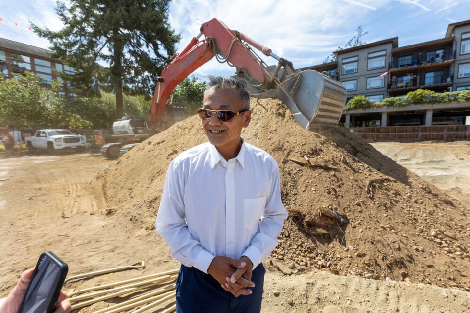 Holden Chu, son of Stan Chu, speaks at the groundbreaking of TownePlace Suites by Marriott on Goldstream Avenue on Wednesday. DARREN STONE, TIMES COLONIST 