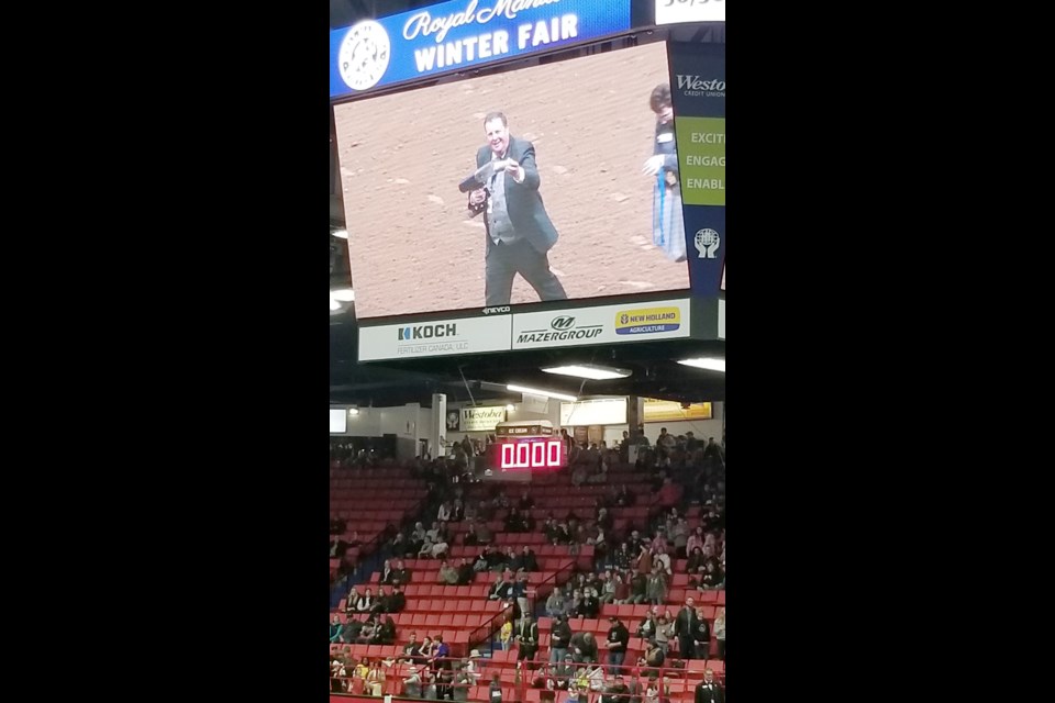 Westoba Place arena: GM of the Manitoba Royal Winter Fair, Mark Humphries, on the big screen above the main arena during Thursday evening’s show as he takes aim with a t-shirt cannon. 