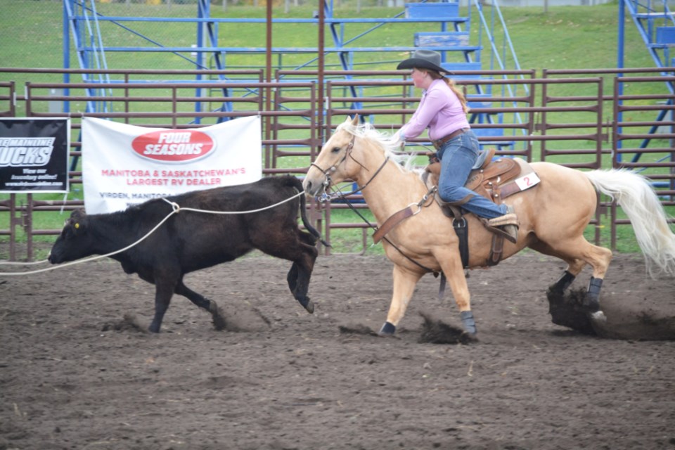 MacKenzie Shauf, riding "BK Harry Cat," takes part in the 4-year-old Breakaway Roping Division.
