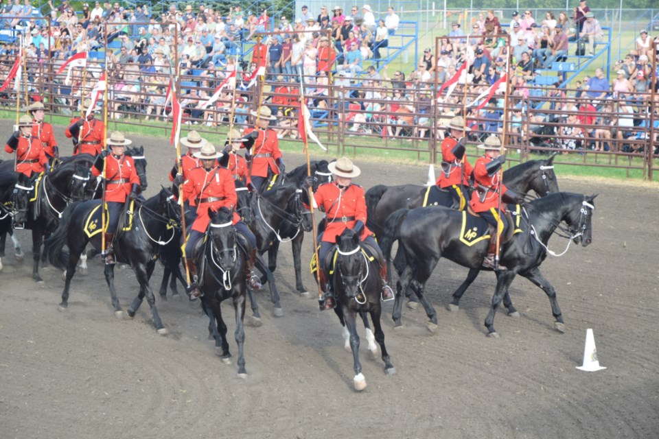 The RCMP Musical Ride performing in the Virden Agricultural Society outdoor arena. RCMP officers perform precision drills on their Hanovarian steeds.