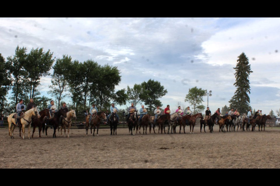Quite a line-up of cowboys and cowgirls for the McAuley Ranch Rodeo opening ceremony.
