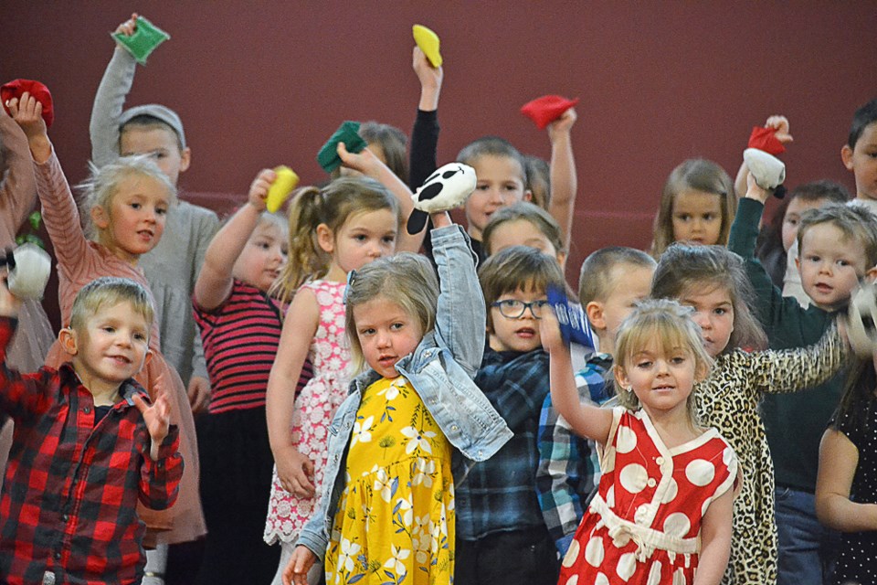 Preschool kids from Virden's Rhythm and Glue Nursery School perform the action song "Shake Your Bean Bag" at the Virden Music and Arts Festival.  