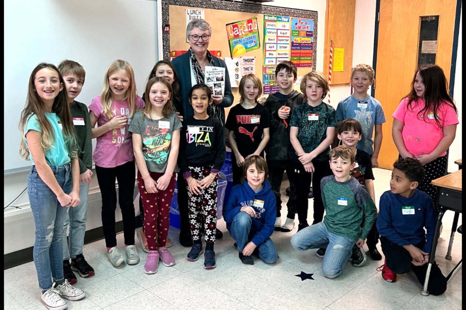 Author Lisa Erixon in Colleen Lewis’ Grade 3 classroom where she reads aloud from “No Ordinary Cats” and holds a lively discussion with the students. PHOTO/SUBMITTED