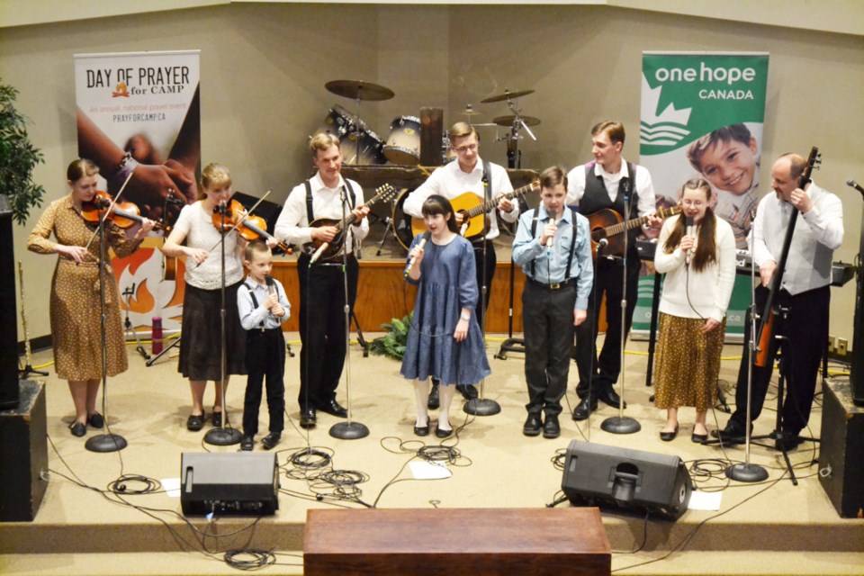The Fehr Family Band perfoming at the One Hope Canada Support Raising Tour: (back l-r) Julianna, Rebecca, Adam, Isaac, Samuel and James; (front l-r) Winston, Harmony, Geoffrey and Olivia. The concert was held in Virden Alliance Church on March 30. 