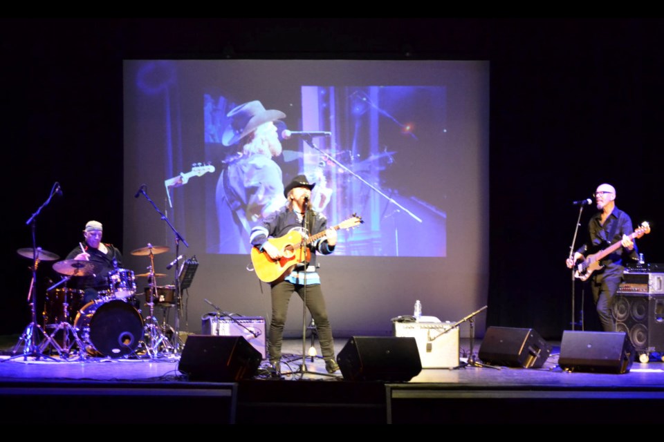 Jason McCoy's three-piece band, including Steve Broadhurst (l) on drums and Chris Byrne (r) on bass, play and sing before an appreciative crowd in the Virden Aud Theatre on May 11. 