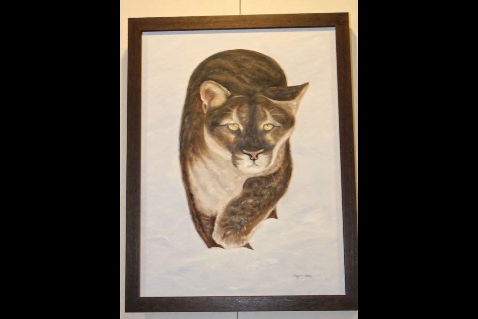 This cougar,  painted by Myrna Gray, has his eye on you. 