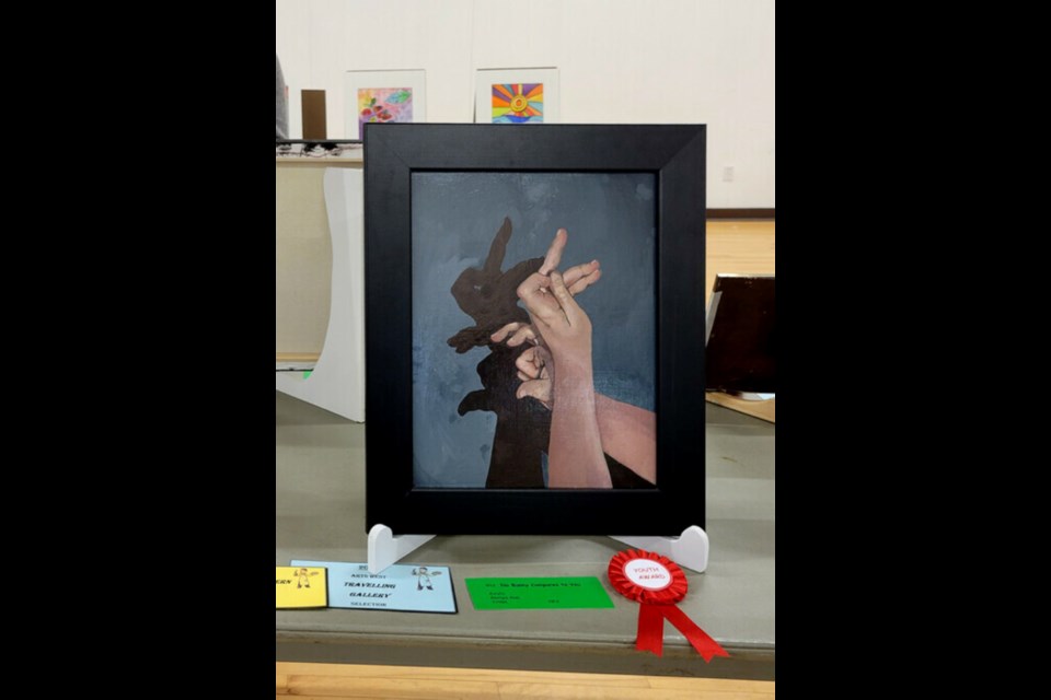 The 2023 Westman Juried Art Show in Carberry: look past the hands in Georgia Abel’s “No Bunny Compares to You” and see that bunny. This was an award winner in the Youth category. ARTSWESTCOUNCIL.CA