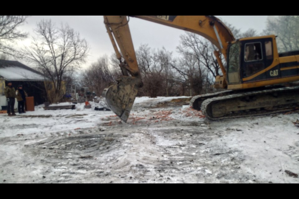 Saturday, Dec. 4, MP Excavation Ltd. joined nearly a dozen people from the Winnipeg area to clean up the site of Hoemsen's burned house.