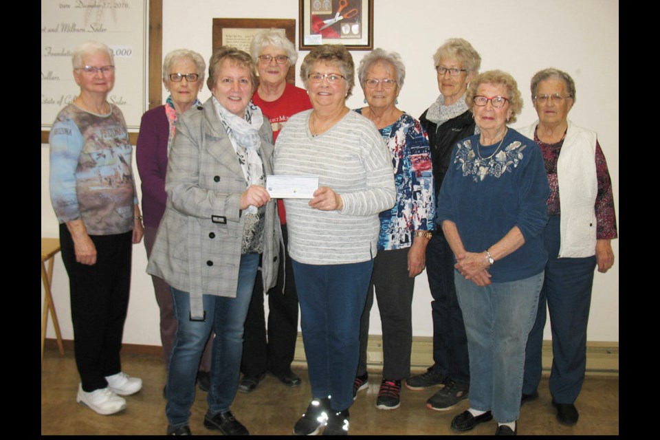 The Elkwood Manor Health Auxiliary recently donated $5,000 to the Moosomin & District Health Care Foundation for a CT Scanner at the Southeast Integrated Care Centre in Moosomin; (l-r) Betty Freeman, Sharon Leslie, Myrna Drake, Noreen Baskerville, Corinne Nesbitt, Cecile Fisher, Bert Kyle; Bernice Hay (front R) presenting the cheque to Wendy Lynd (front L). Missing President Mryna Orr. 
