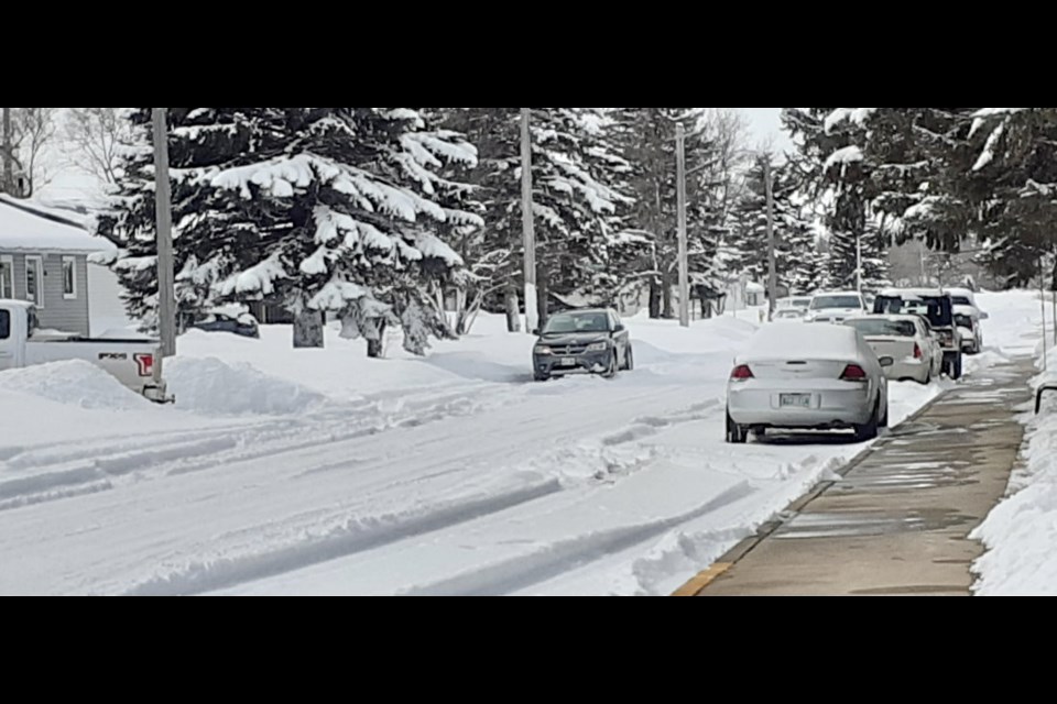 Snow piles up quickly in early April on Virden streets. Parked cars can make street clearing a tricky business, but small vehicles can also get stuck trying to navigate in snow like this.