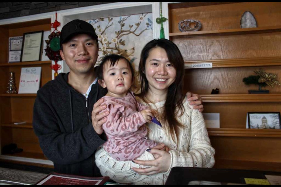 Marco Zhong, and Michelle Loubert and their daughter Khloe.
