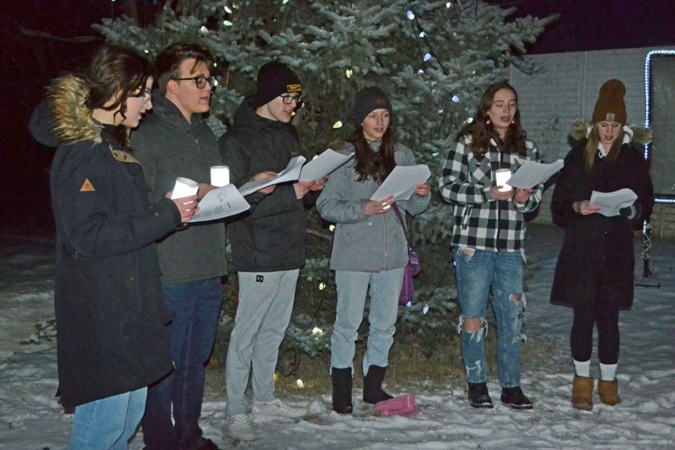 A group of local youth sang familiar Christmas Carols during the Virden Memory Tree Light-Up on Seventh Ave. 