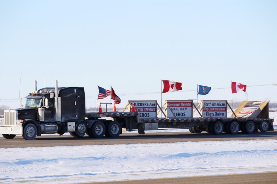 Ottawa-bound, the Freedom Convoy rolls past Virden, Man. on Jan. 25, 2022. 