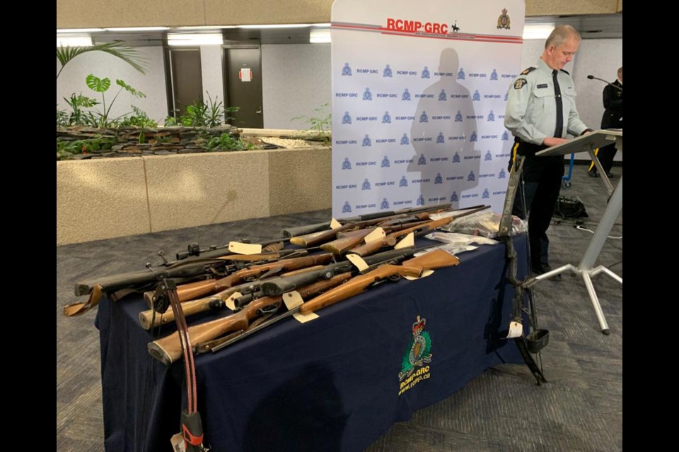 13 firearms; 22 other weapons were part of the seizure.