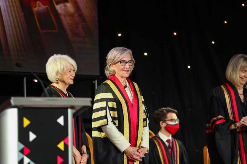 Dr. Charlotte Yates in the robe of honour at her induction ceremony as President and Vice-Chancellor, University of Guelph. Vice-Chair of the Board of Governors Nancy Brown Anderson (left). 