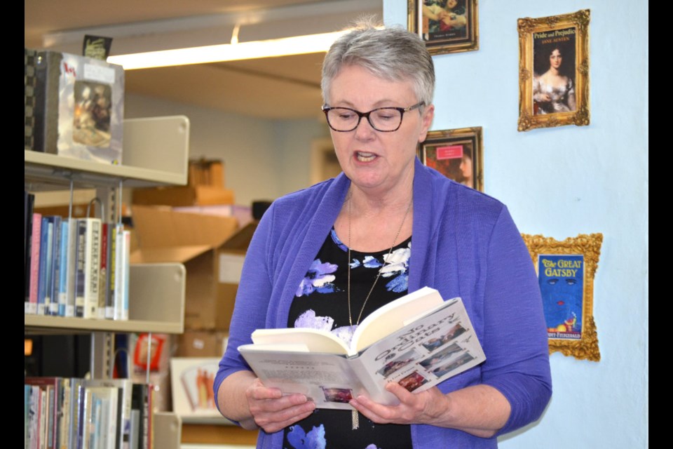Author Lisa Erixon of Lyleton reads from her new book "No Ordinary Cats" during a presentation at the Border Regional Library in Virden on Feb. 2. 