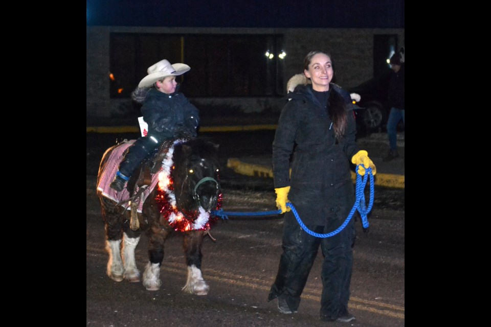 Lane McLeod (rider) and Baylee Gabrielle with a pony in the Santa Claus Parade on Nov. 26.