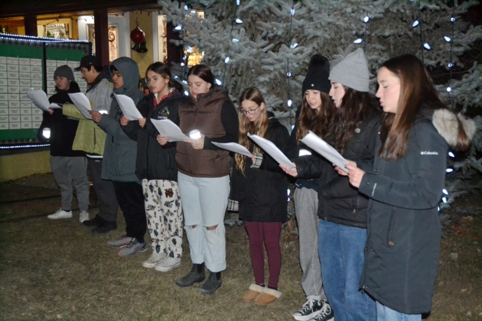 Members of the Virden Collegiate Institute Choir sing carols following the official tree lighting. 