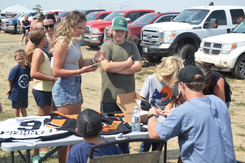 Sanheim signs autographs for fans during the Elkhorn Homecoming/Western Weekend, Aug. 6.  