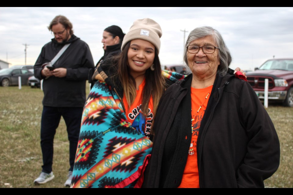 Linda Eastman and her granddaughter at Canupawakpa pow wow grounds, before Linda leaves her community to join a Truth and Reconciliation gathering near the Birtle Residential School grounds an hour north of Canupawakpa.