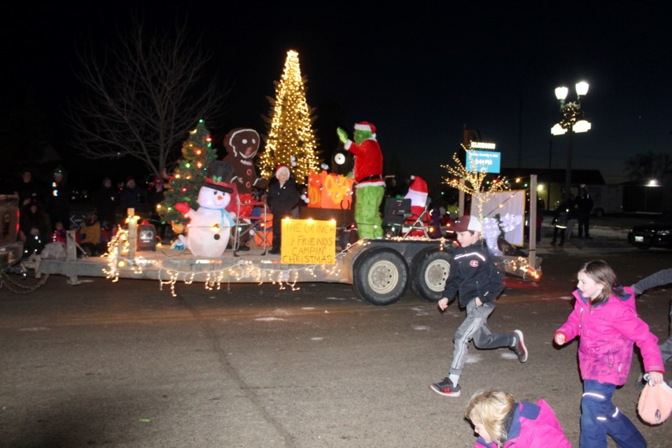 The Grinch floats past in the Santa Parade on Richhill Ave.