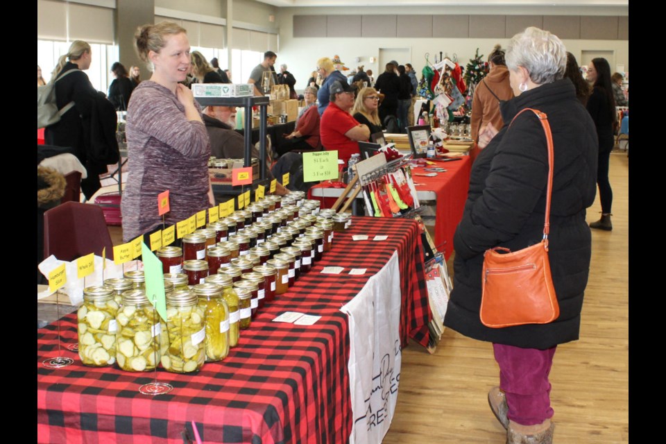 At Aunt Dee Dee's Preserves, Danille Ducharme of Reston talks with a customer.