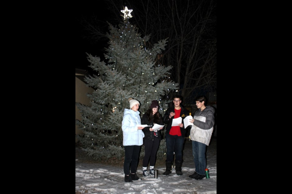 Carolers (l-r) Kierra Peters, Charlie Dunning, Cody Thiessen and Jamie Thiessen led the crowd in familiar favourite Christmas carols and wintery songs.